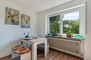 a white room with a table and a window at Ferienwohnung Schwarzwaldmädel in Seelbach