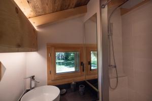 a bathroom with a toilet and a sink and a window at Chalet Pierre d Anatase in Saint-Gervais-les-Bains +19 photos