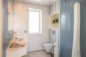 a bathroom with a toilet and a shower at Sai Gayatri in Nerja +17 photos