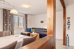 a dining room with a table and a couch at Ferienwohnung Dachtler in Hinterzarten