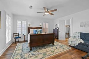 a living room with a bed and a couch at Red Bluff Cottage in Montgomery