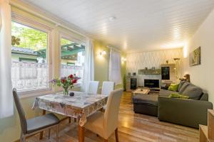 a living room with a table and a couch at Ferienbungalow 2 in Boitzenburg in Boitzenburg