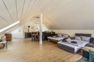 a living room with a couch and a table at Pistenblick in Willingen