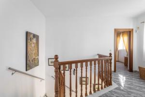 a staircase in a house with a picture on the wall at Villa Eden Nerja in Nerja +20 photos