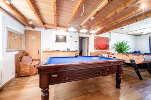 a large room with a pool table in it at Chalet Elisthur in Saint-Jean-d'Aulps