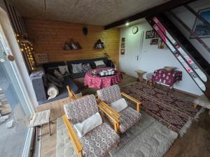 an overhead view of a living room with a table and chairs at Villa Freddie Mavrovo - Lakeview House in Mavrovo