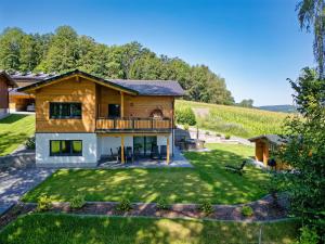 an image of a house with a yard at Luxus Chalet Landhaus Rachelblick in Eppenschlag