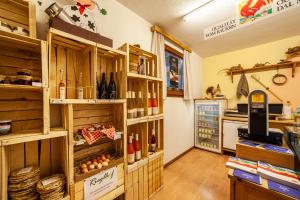 a wine shop with a lot of bottles of wine at Rieglhof Apartment Geiernest in Curon Venosta