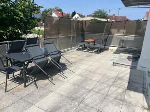 a group of chairs and a table on a patio at Dreams im Obergeschoss in Koetz 