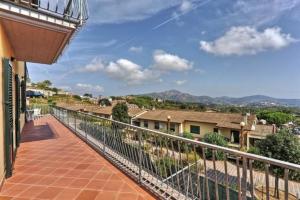 a balcony with a view of a city at Casa Consuelo App. 1 (trilocale) in Capoliveri +12 photos