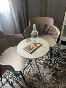 a bottle of water sitting on a table in chairs at Quinta da Vigia in Angra do Heroísmo
