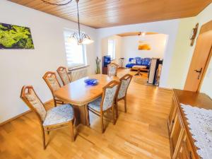 a dining room with a table and chairs at Ferienwohnung Ella, 95qm, Terrasse in Todtnau +18 photos