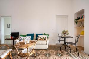 a living room with a couch and a table at Maison Valentina in Monopoli