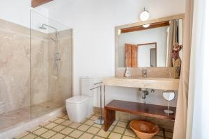 a bathroom with a sink and a shower and a toilet at Ca na Francesca in Pollença +17 photos