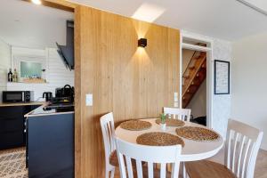 a kitchen and dining room with a table and chairs at Schwarzwaldtraum in Sasbachwalden