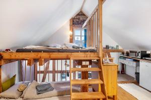 a loft bed in a tiny house at Tiny House an der Werra in Bad Sooden-Allendorf +17 photos