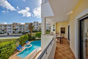 a view of the pool from the balcony of a apartment at Chez Hélène et Paulo - Lagos in Lagos