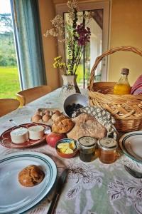 a table topped with plates of food on a table at Casa Chã in Alcobertas +28 photos