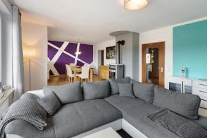 a living room with a couch and a dining room at Sonnenblick in Lenzkirch