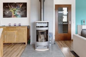 a kitchen with an oven in the middle of a room at Sonnenblick in Lenzkirch
