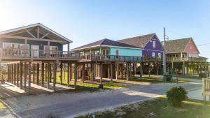 a row of houses on stilts at Ocean View l Pet Friendly in Gilchrist