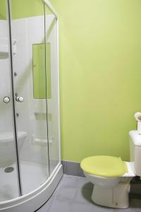 a bathroom with a toilet and a glass shower at La Platería I in Mambrilla de Castrejón