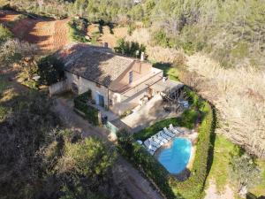 an aerial view of a house with a swimming pool at Cal Contra in Gélida