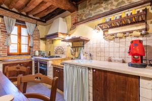 a kitchen with a large counter top in a room at Beb Pulcino Nero Scrofiano in Scrofiano