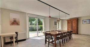 a dining room with a table and chairs at Ô Pré des Fleurs in Amanlis +36 photos