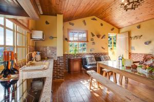 a kitchen with a counter and a table in a room at Tmg Casa La Chocita in Los Realejos +14 photos