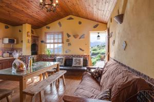 a living room with a couch and a table at Tmg Casa La Chocita in Los Realejos