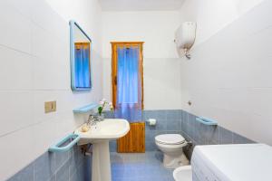 a bathroom with a sink and a toilet at La vista di Mondo in Torre Dei Corsari +18 photos