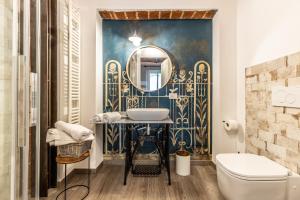 a bathroom with a sink and a mirror at Le Zucche Vuote in Quargnento +63 photos