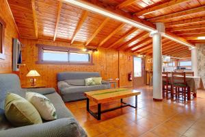a living room with couches and a table at La Casita de Vidal in Tuineje
