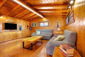 a living room with a couch and a table at La Casita de Vidal in Tuineje
