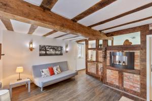 a living room with a couch and a fireplace at Wohnung 1 in Wallhausen