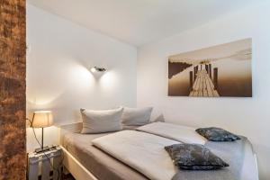 a bedroom with a bed with two pillows on it at Wohnung 1 in Wallhausen