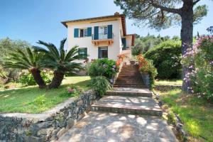 a house with a staircase leading up to it at Villa Mesco in Levanto