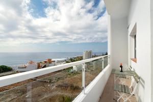 a balcony with a view of the ocean at Punta del Hidalgo La Laguna in Punta del Hidalgo
