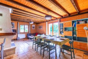 a dining room with a table and chairs at Chalet L'oréade in Manigod +30 photos