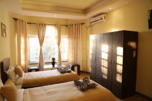 Letto o letti in una camera di Bed and Breakfast Thamel