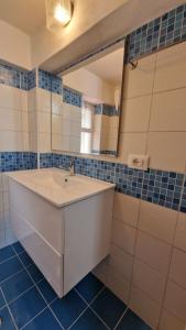 a bathroom with a white sink and a mirror at Appartamenti Con Vista Mozzafiato in Praia a Mare
