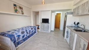 a kitchen with a sink and a refrigerator at Appartamenti Con Vista Mozzafiato in Praia a Mare +38 photos