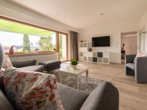 a living room with a couch and a table at Ferienwohnung Pusteblume in Kappelrodeck