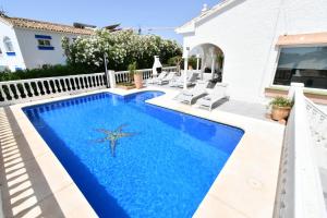 a swimming pool with a starfish in the middle at Villa with separate apartment in Mijas Costa