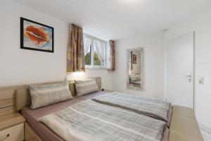 a bedroom with a bed in a room at Preiser in Moos