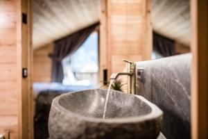 a sink in a bathroom with a faucet at New Chalet Brunegg Weissenbach in Rio Bianco