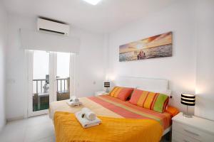 a bedroom with a bed with towels on it at Bonamar in Arona