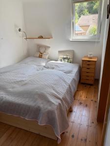 a bedroom with a bed and a window at Haus herhönspatziert in Willmars