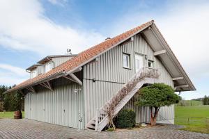 a large white building with a staircase on it at Appartement in Wangen im Allgäu